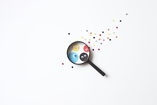 Paper dots seen through a magnifying glass